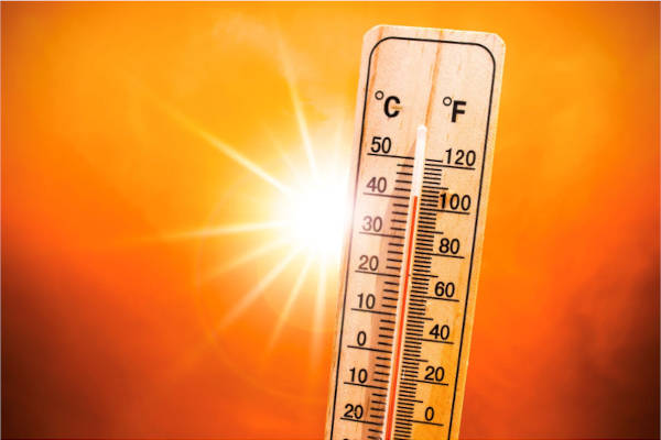 A thermometer graphic with a sun blazing behind it