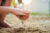 Children's hands playing in regular sand