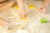 Childrens hands playing flour, rolled out dough and cookie-cutting shapes