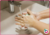 A child's hands washing with soap and water, a good way to prevent disease spreading