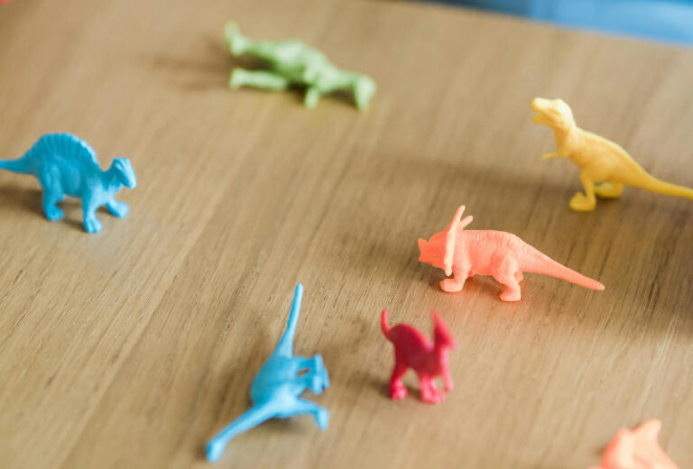 Toy dinosaurs on a table
