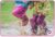 Two children jumping in muddy puddles with wellies on