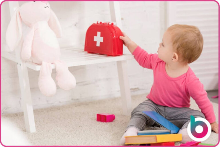 a child reaching for a toy first aid kit