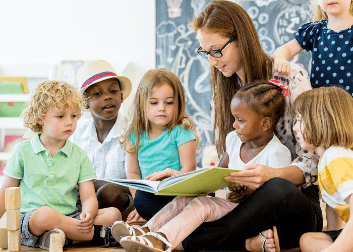 A woman reading stories to children for world book day