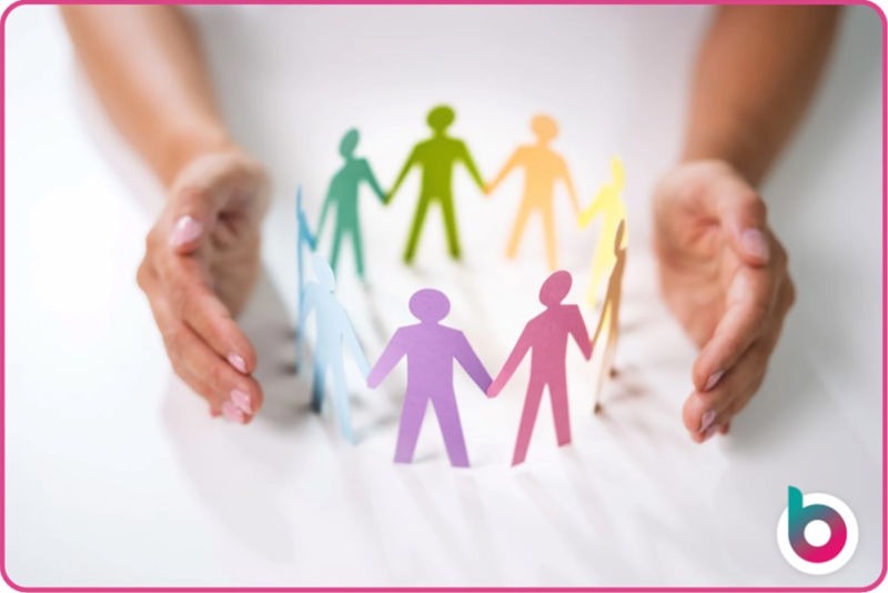 Childs hands around people cutouts