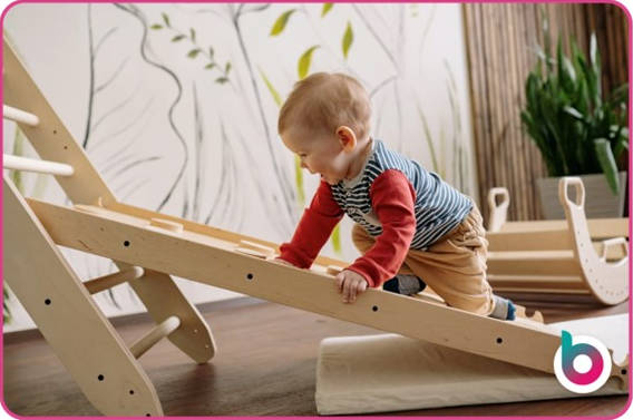 a child climbing a low slope ladder