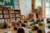 A collection of cardboard caves on the floor of a nursery or schoolroom