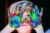 Elmer activities image - a child with hands covered in mixed paint