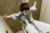Child flying on adult's upturned feet