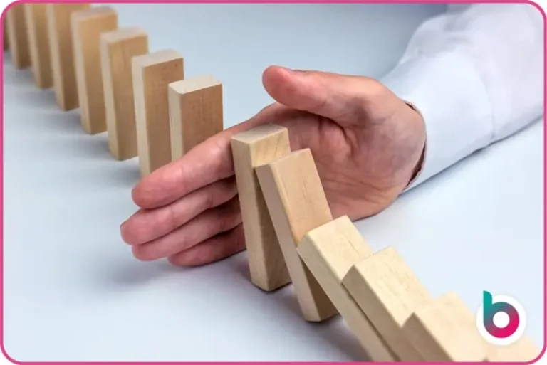 Hand stopping dominoes
