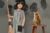 Room on the Broom image - a child holding a witch broom next to a cat on a stool