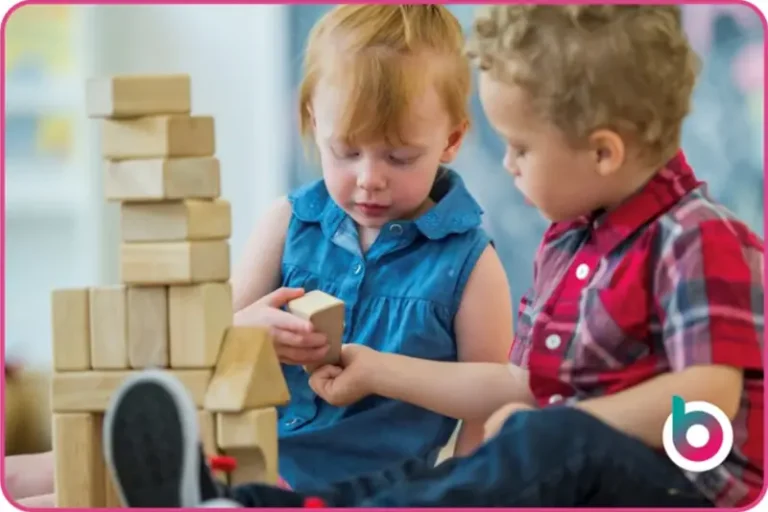 Mutual Respect image - Two children playing together with wooden blocks