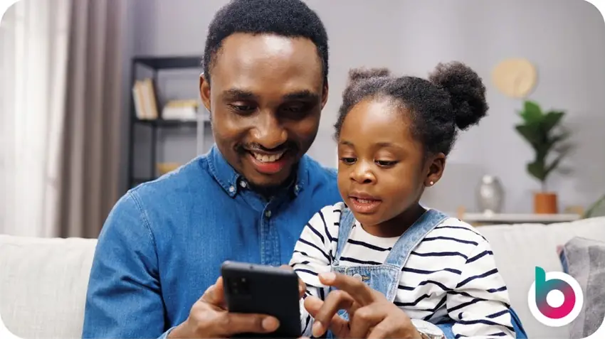 Adult and child using a smartphone at home