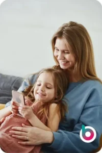 Adult and child using a smartphone at home