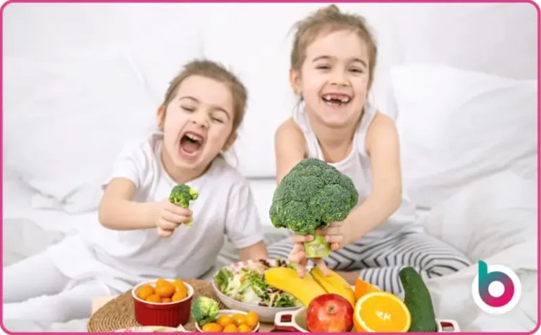 Children playing with their food and a huge broccoli