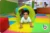 a child crawling out of a colourful pop tunnel