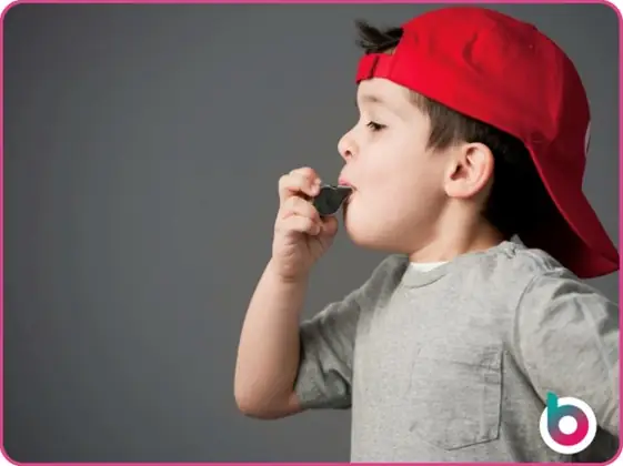 Child blowing a whistle