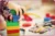 a child's hands playing with Duplo