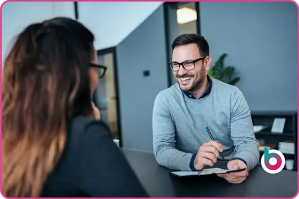 a man interviewing a woman