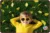child wearing sunglasses lying on grass