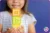 a child holding letter blocks