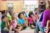 an adult reading a story to a group of children