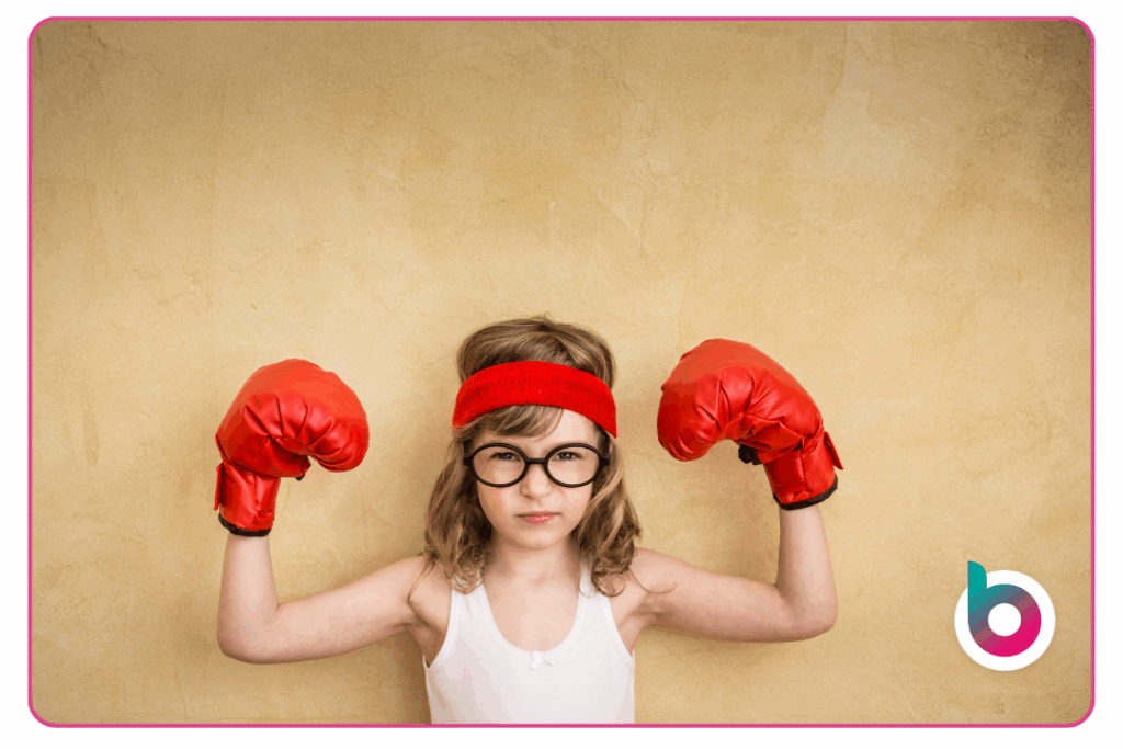 An image of a child with boxing gloves on